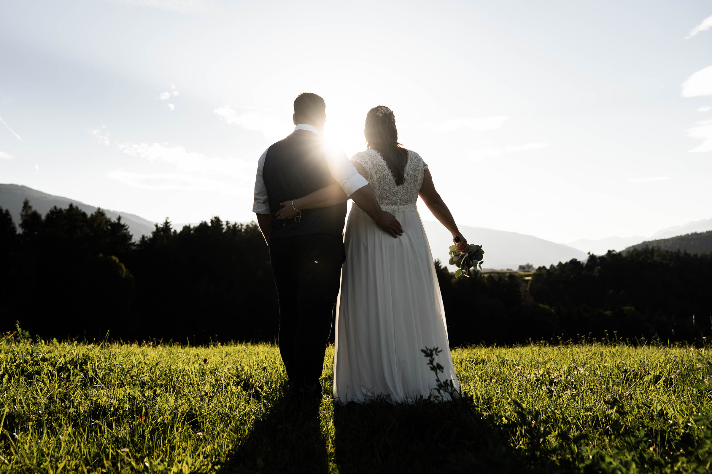 Couple at sunset, last light through the trees