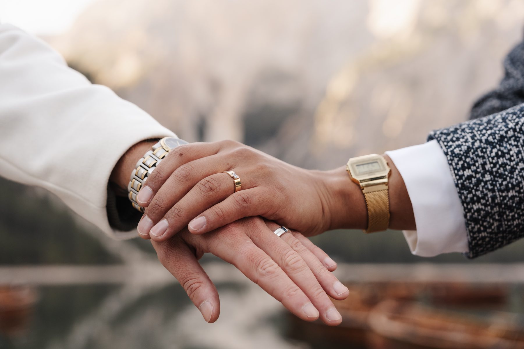 Hands with wedding rings on the edge of the rowing boat