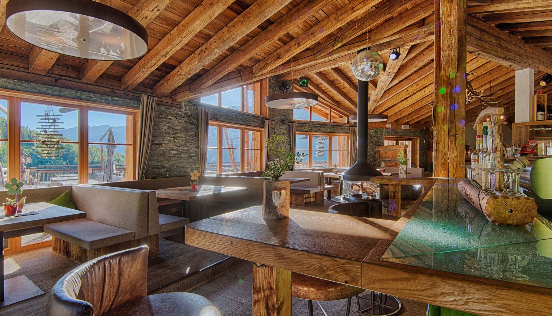 Bar and lounge with a view of the valley through the windows