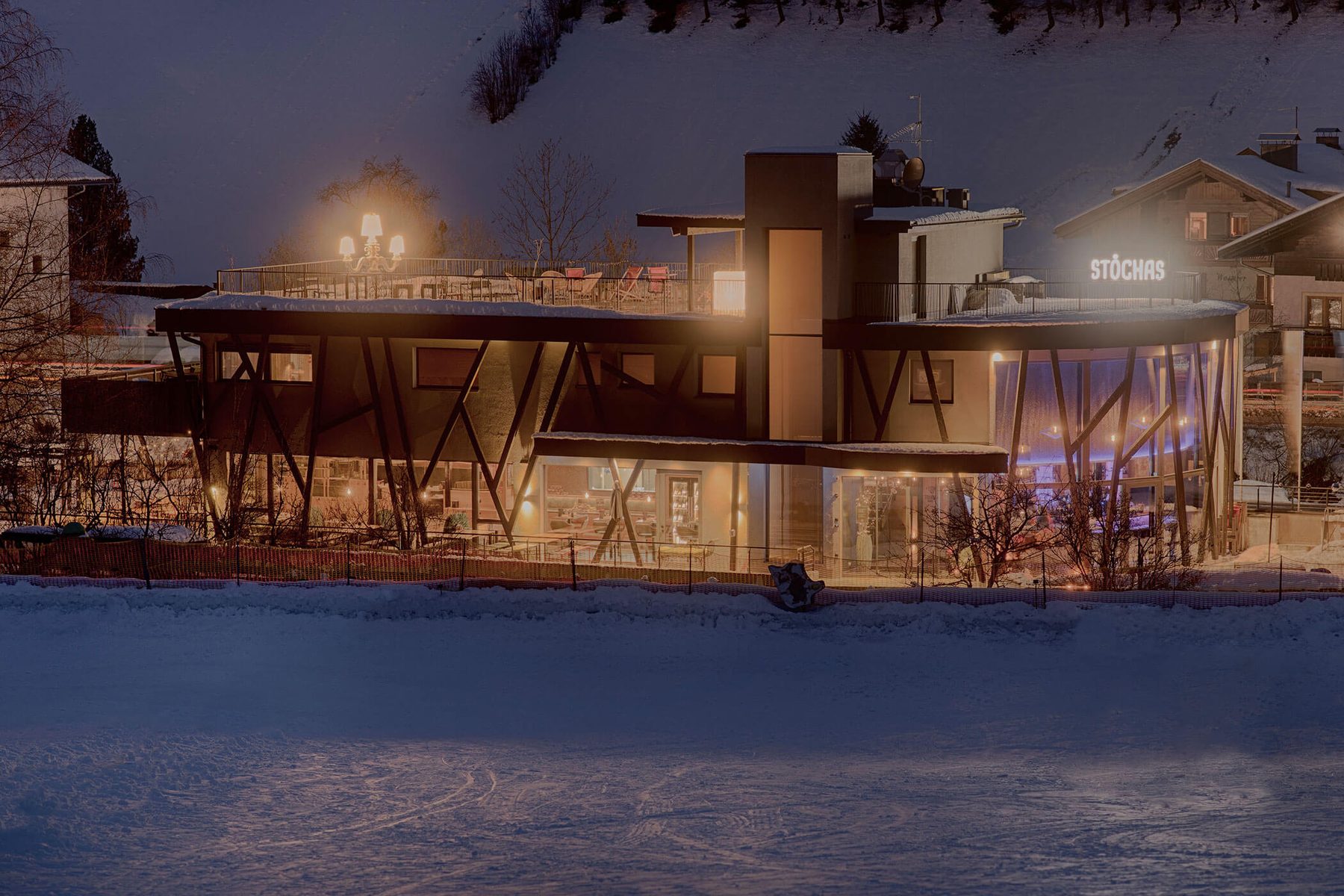 Stochas in the evening, lit up, snow all around
